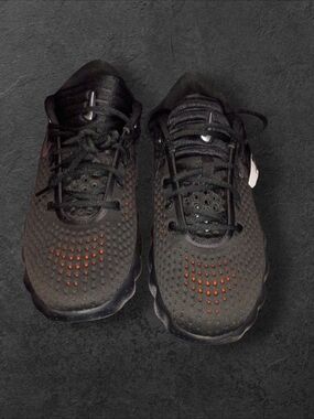 Nike Men's Black Sneakers with Orange Detailing